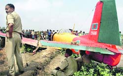 Policemen guard the Bangladeshi military aircraft at Salar in West Bengals Murshidabad district