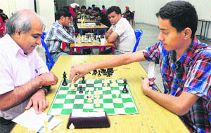 Himal Gusain moves against CM Sharma during the Chandigarh Chess Tournament at St Xavier Senior Secondary School, Sector 44, Chandigarh, on Friday.