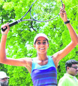 Karman Kaur rejoices after winning the U-14 and U-16 girls titles during the CLTA-AITA Tennis Tournament in Chandigarh on Friday.