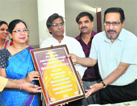 Ranu Bisht being honoured with the Rita Sharma Memorial Award for her contribution in women empowerment during a function at MKP College in Dehradun on Thursday.