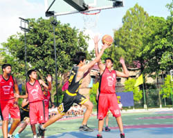 A match in progress in the All-India Afzal Khan Memorial Basketball under way at The Doon School in Dehradun on Friday. 