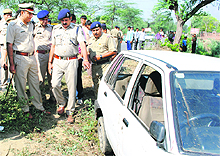 SP KK Rao (left) inspects the crime scene in Panipat on Friday.