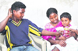 Bonded labourers Shankar and his wife Sonia with their daughter Priya in Jalandhar after being freed by the Pendu Mazdoor Union