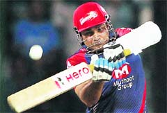 Delhi Daredevils Virender Sehwag plays a shot against Mumbai Indians during their match in New Delhi. 