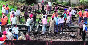Workers engaged in laying new tracks as part of the maintainance work near the Amritsar railway station on Saturday.