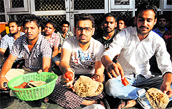 Students show the substandard food served at Baba Banda Singh Bahadur boys hostel in Sector 25 of Chandigarh on Saturday