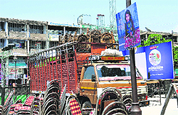 Chairs lie unloaded from a truck parked at the Sector-17 plaza for a function
