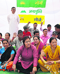 Members of the Gorkha Janmukti Morcha hold a protest at the Parade Ground in Dehradun on Saturday