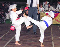 Participants in action at the Third Ludhiana District Karate Championship at the PAU on Saturday.