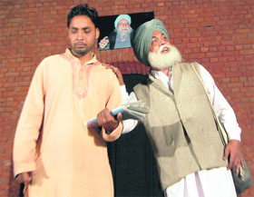 Artistes stage the play “Baba bolta hai” at the Punjab Kala Bhavan in Chandigarh on Sunday