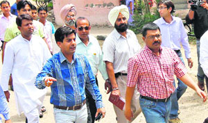 Councillor Saurabh Joshi (blue shirt) along with Vivek Pratap Singh, Municipal Commissioner, at Khudda Lahora on Sunday.