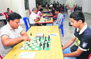 A player makes a move against his opponent at Chandigarh Chess Tournament 2012 final match at St Xavier Secondary School in Sector 44 in Chandigarh.