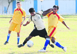 Players struggle for ball during a football match at 3BRD Air Force Station in Chandigarh on Sunday. 