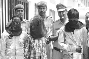 The three robbery accused being taken to the district court at Panchkula on Sunday.