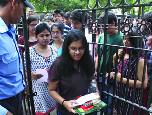 Students enter a centre to write the All-India Engineering Entrance Examination-2012 in New Delhi on Sunday.