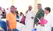Uttarakhand Planning and Sports Minister Dinesh Aggarwal listens to the problems of people at Sevlakalan in Dehradun on Sunday.