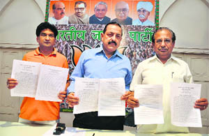 BJP leaders display copies of the resolution passed on human rights violations in Gilgit-Baltistan, in Jammu on Sunday. 