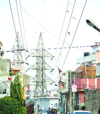 A mesh of power cables at the Guru Nanakpura locality.