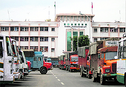 Files lying in a government office; gunny bags containing files being loaded on to a truck; vehicles outside the Secretariat