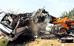 The wreckage of the ill-fated private bus in Gorakhpur on Sunday.  PTI