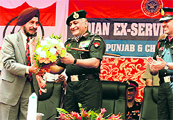 Army Chief General VK Singh receives a bouquet from a member of the Indian Ex-services League in Baddowal on Sunday