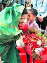President Pratibha Devisingh Patil being greeted by a child during her ceremonial reception at Mahe airport, Victoria in Seychelles on Sunday