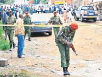Policemen secure the site of a grenade attack in Nairobi on Sunday