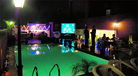 A restaurant has put large television screens on poolside.