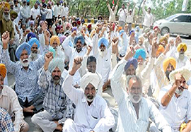 Members of the Military Engineering Service (MES) Union staging a protest in support of their demands in front of the office of the Commander Works Engineer (CWE) near the Cantonment police station in Bathinda on Monday.