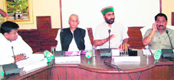 Uttarakhand Agriculture Minister Mantri Parsad Naithani (in cap) addressed a meeting of officers in Udham Singh Nagar 