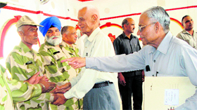 Commander Inder Singh, president Ex-servicemen League, Haryana, meets ex-servicemen in Kaithal.