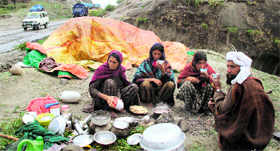 A Gujjar family take a halt near Nandni on the Jammu-Srinagar national highway.