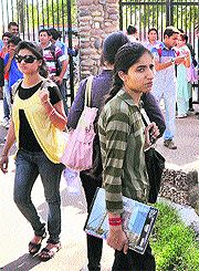 Students wait for the main gate to be reopened.