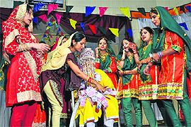Students perform during the cultural function Dharohar at Rajindra Auditorium in the University of Jammu on Monday. 