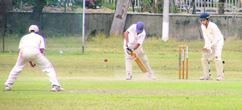 A batsman plays a defensive shot in a match between Ludhiana and Mohali at the PAU on Monday.
