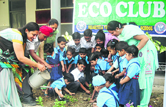 Students of BVM school, Udham Singh Nagar, plant saplings on the school premises.