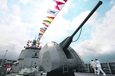 The cannon of Chinese missile destroyer Haikou (171) is seen in Hong Kong on Monday. The missile destroyer and a missile frigate made a port call in Hong Kong to commemorate the 15th anniversary of its handover from Britain to China.