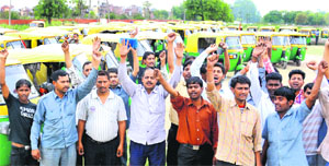 Members of the LPG Auto Drivers Union stage a dharna at Sector 25 in Chandigarh on Tuesday. 