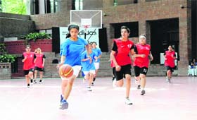 Players in action in a match in the 6th Welham Girls Basketball Tournament under way at Welham Girls School in Dehradun on Tuesday