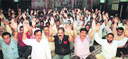 Members of the National Mazdoor Conference stage a protest to observe May Day in Jammu