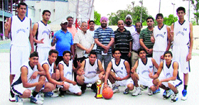 Winners of the 63rd Junior Punjab State Basketball Championship with their trophy.