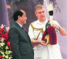 Prince Andrew (R) being presented with traditional Naga headgear in Kohima, Nagaland, on Tuesday
