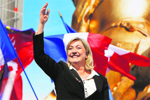 Frances National Front leader Marine Le Pen waves after a speech in Paris. 