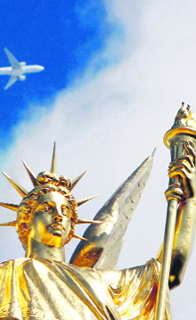 A golden bronze sculpture on top of the Opera Garnier in Paris. 