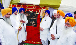 SGPC chief Avtar Singh Makkar lays the foundation stone of a school building in Amritsar on Wednesday. 