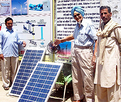 Bhupinder Singh shows a fan running with solar energy at his research centre at Ghas Mandi in Fazilka
