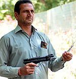 Ram Dev, one of the experts from Chhatbir, displays his tranquilising gun