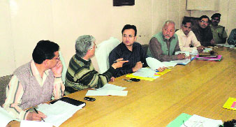 Akshat Gupta, District Magistrate, Almora, presides over a meeting on Wednesday.