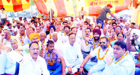 Depot holders protest in front of the Deputy Commissioners office in Jalandhar on Wednesday.