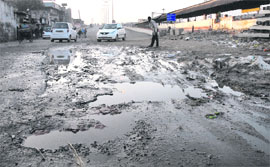 The road from the city railway station to Domoria overbridge is in a bad shape. 